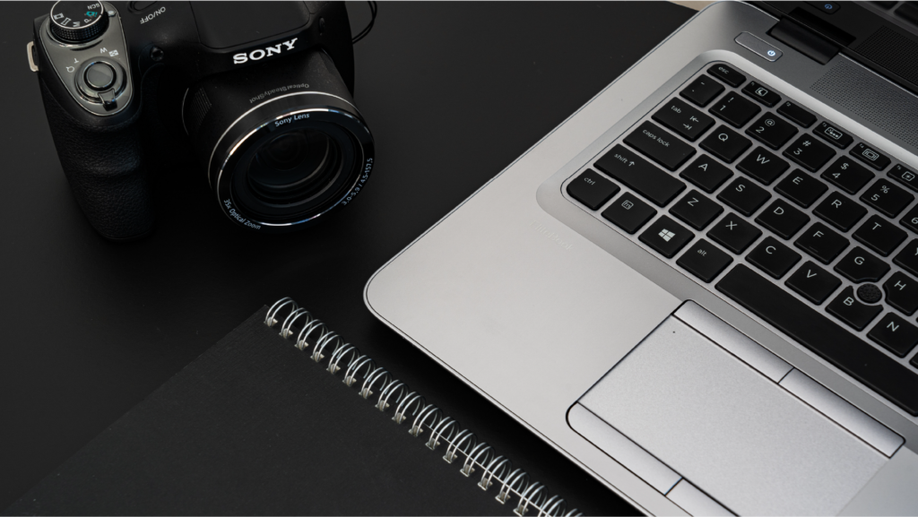 Camera and laptop pictured from above