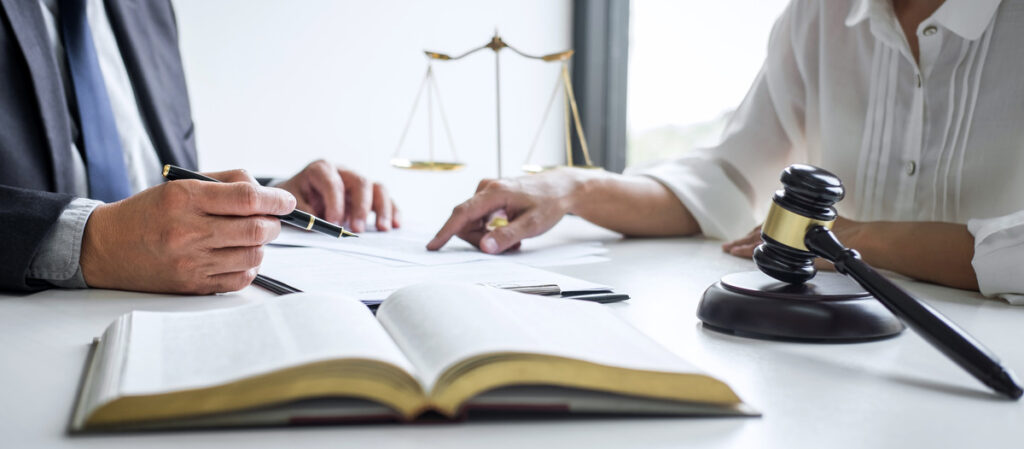 Two people collaborating at a law firm